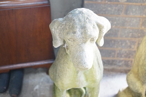 A reconstituted stone seated hound garden ornament, height 72cm